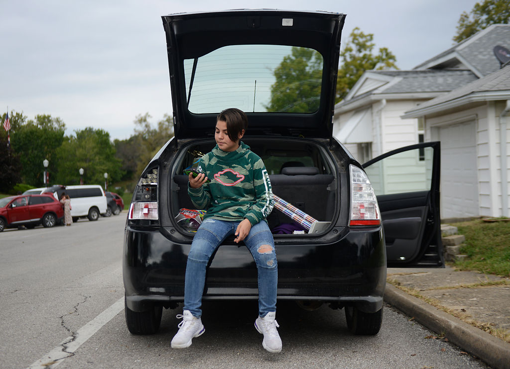 Wyatt Bonaparte, 12, sits in the trunk